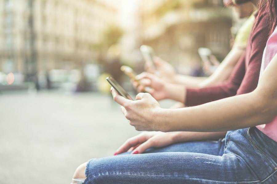 Several people holding cell phones